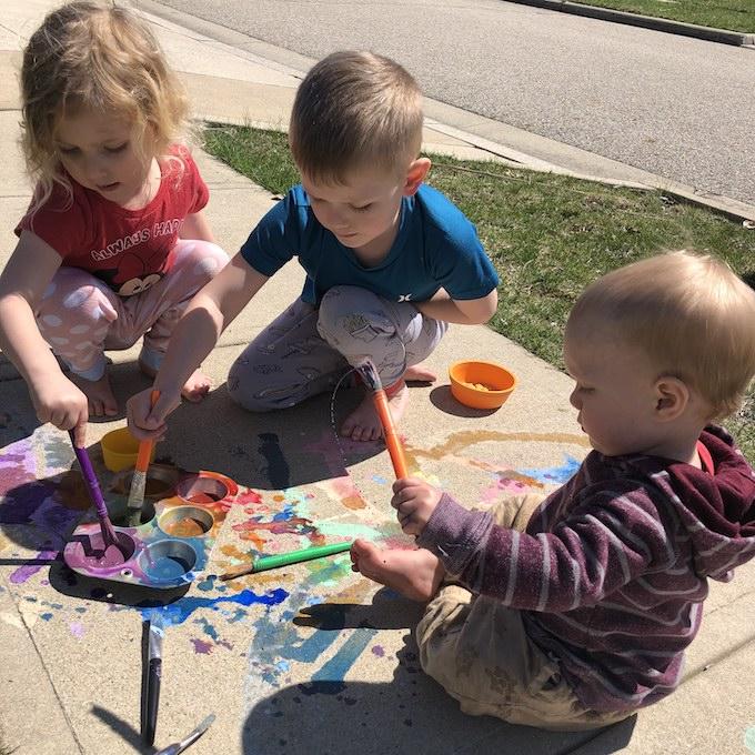 At-Home Activities For Kids 8 kids with sidewalk chalk paint